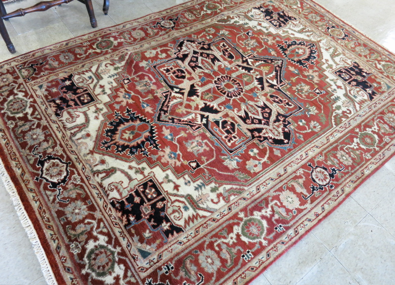 Appraisal: HAND KNOTTED ORIENTAL CARPET Persian Serapi design centering a large