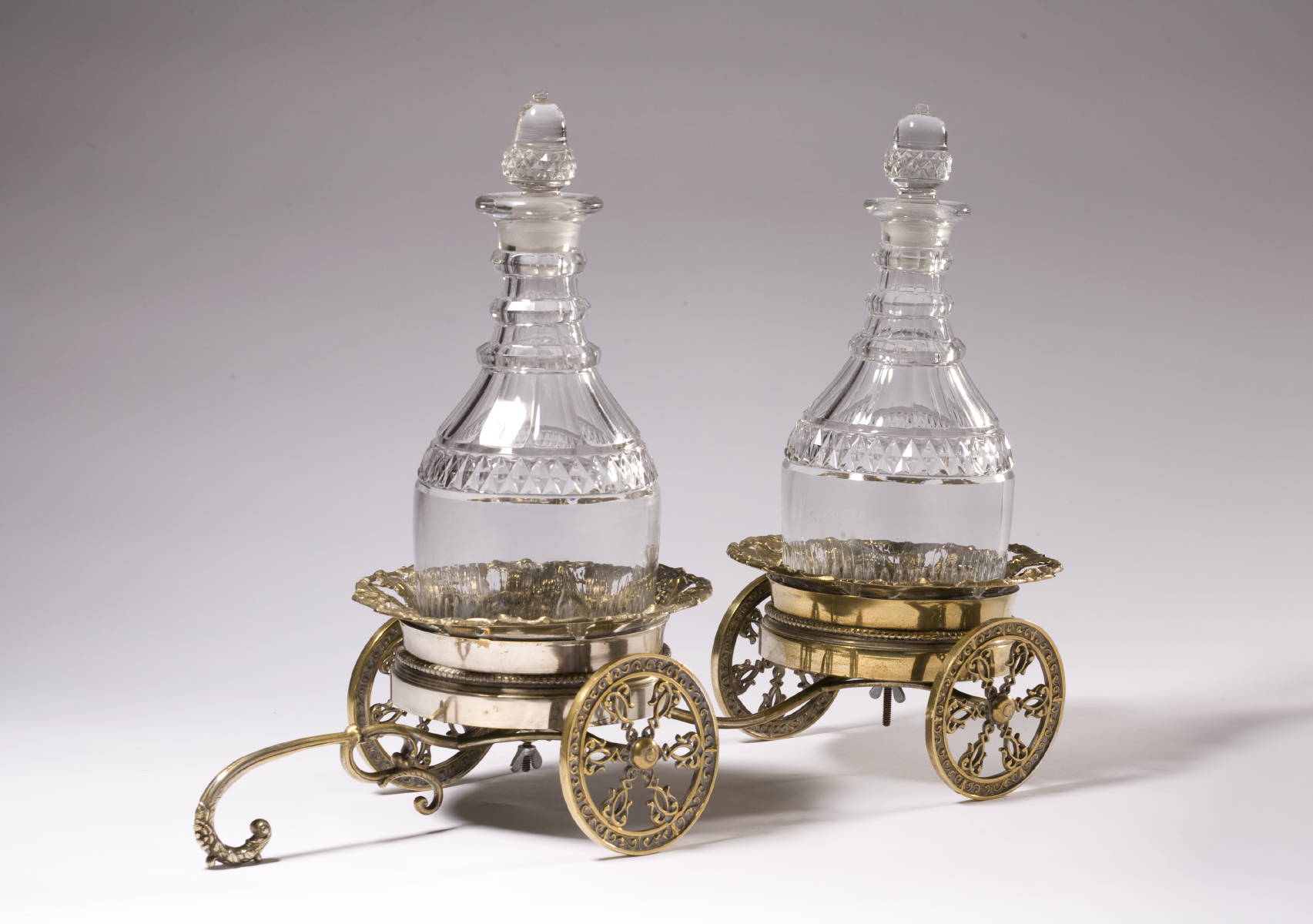 Appraisal: VICTORIAN SILVERPLATE WINE TROLLEY AND A PAIR OF ANGLO-IRISH DECANTERS