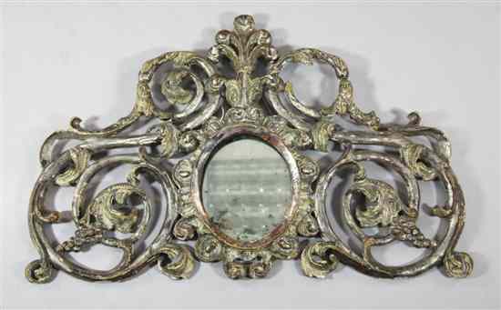 Appraisal: An th century Venetian silvered carved wood cartouche wall mirror