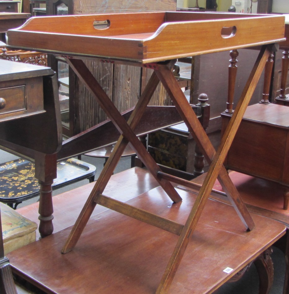 Appraisal: A th century mahogany butlers tray with pierced loop handles