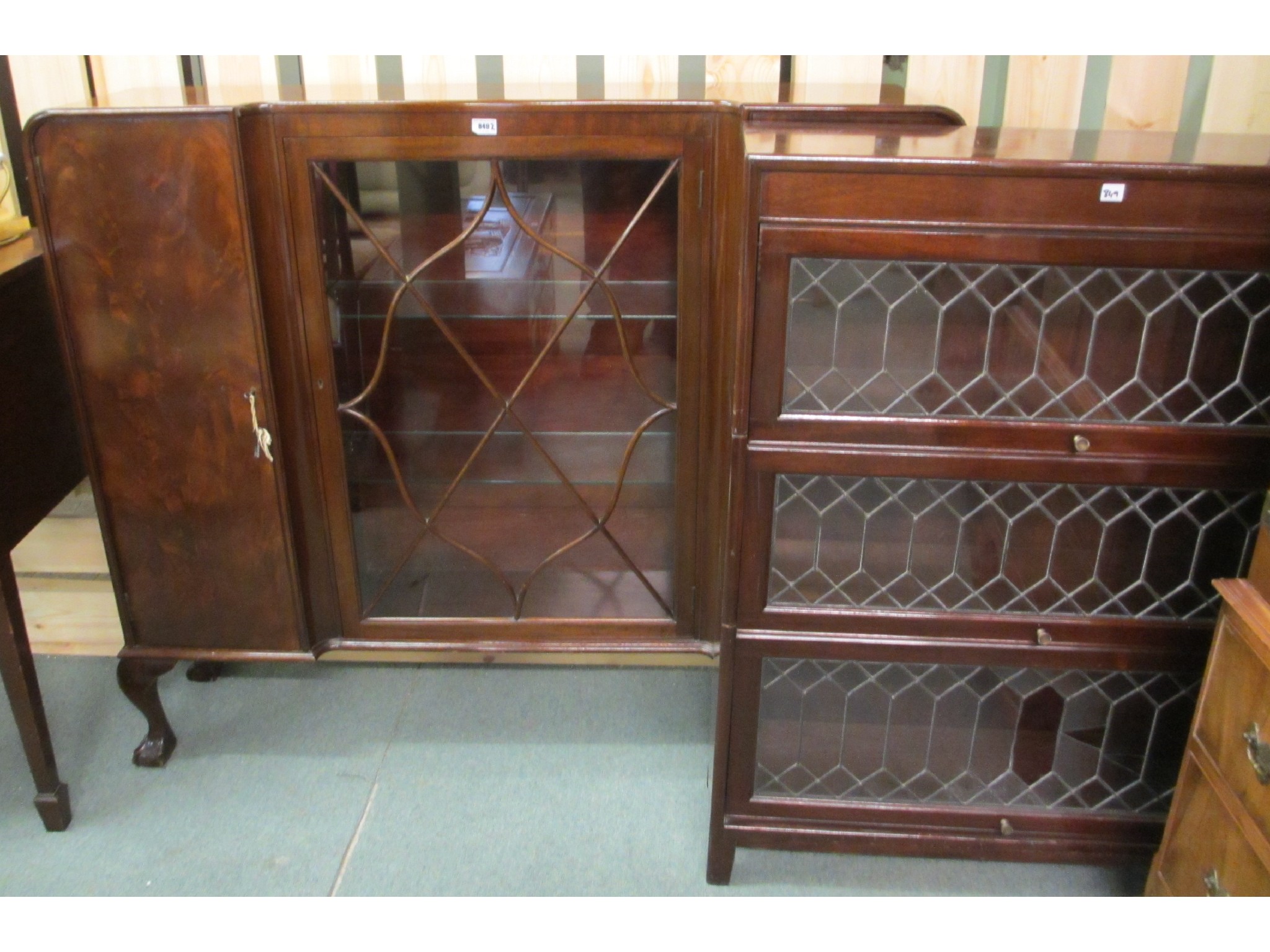 Appraisal: Sectional book case and flame mahogany display cabinet