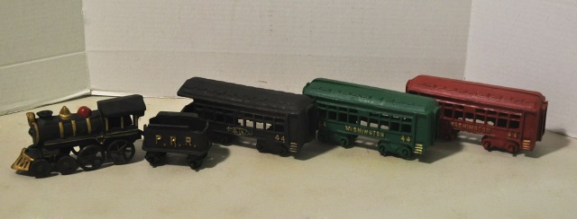 Appraisal: Reproduction Cast Iron Train SetWith engine tender and three cars