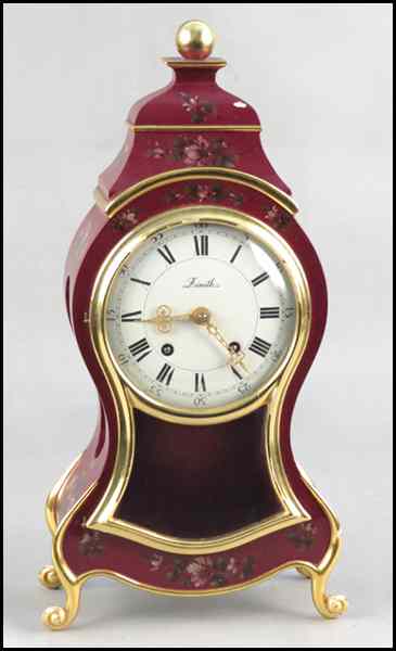 Appraisal: ZENITH LACQUERED AND PAINTED MANTLE CLOCK With a Swiss movement