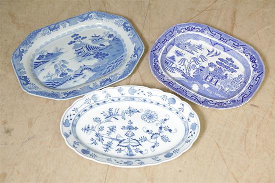 Appraisal: THREE BLUE AND WHITE PLATTERS Including one large charger or