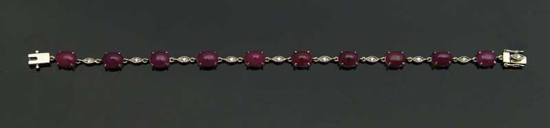 Appraisal: GOLD DIAMOND AND RUBY BRACELET White gold bracelet having ten