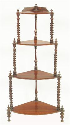 Appraisal: A Victorian walnut corner etagere with spiral twist and baluster