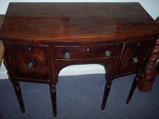 Appraisal: A Regency mahogany bowfront sideboard fitted a central drawer with