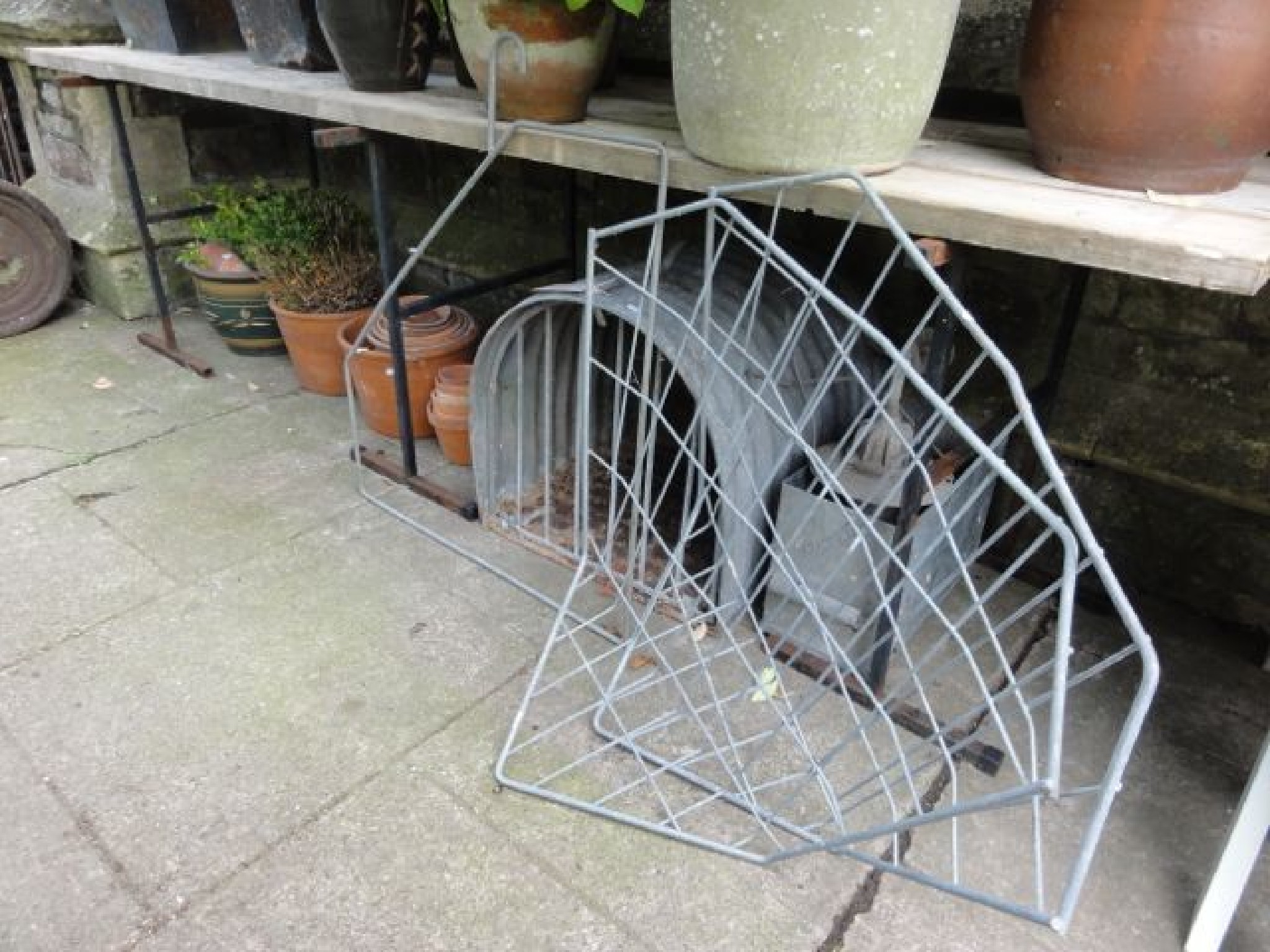 Appraisal: A galvanised portable corrugated animal shelter of arched form further