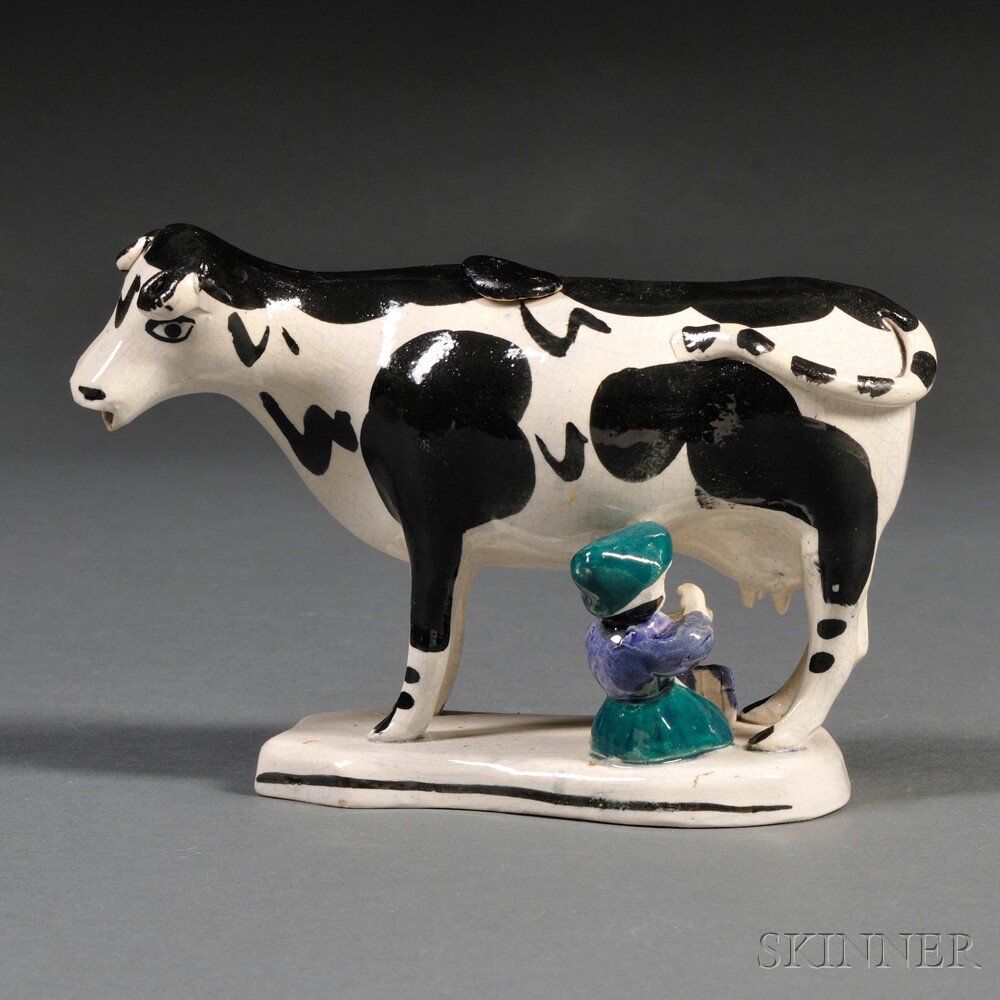 Appraisal: Pottery Cow Creamer with Milkmaid possibly Portobello pottery Scotland late