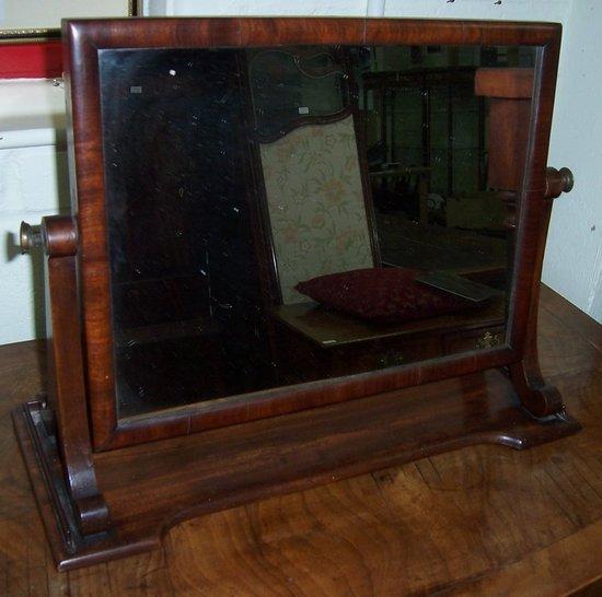 Appraisal: A th Century mahogany swing frame mirror the rectangular plate