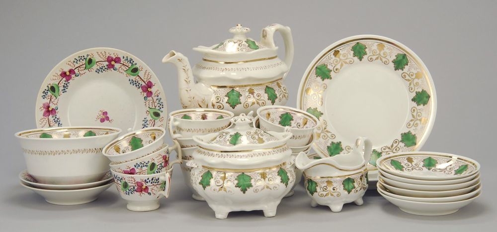 Appraisal: ANTIQUE STAFFORDSHIRE PARTIAL TEA SET With green luster and gilt