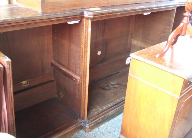 Appraisal: A Victorian breakfront side cabinet with four glazed doors raised