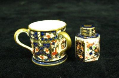 Appraisal: A Royal Crown Derby miniature hexagonal teapoy and cover painted