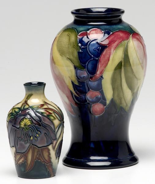 Appraisal: MOORCROFT Pomegranate vase together with an abstract vase Moorcroft