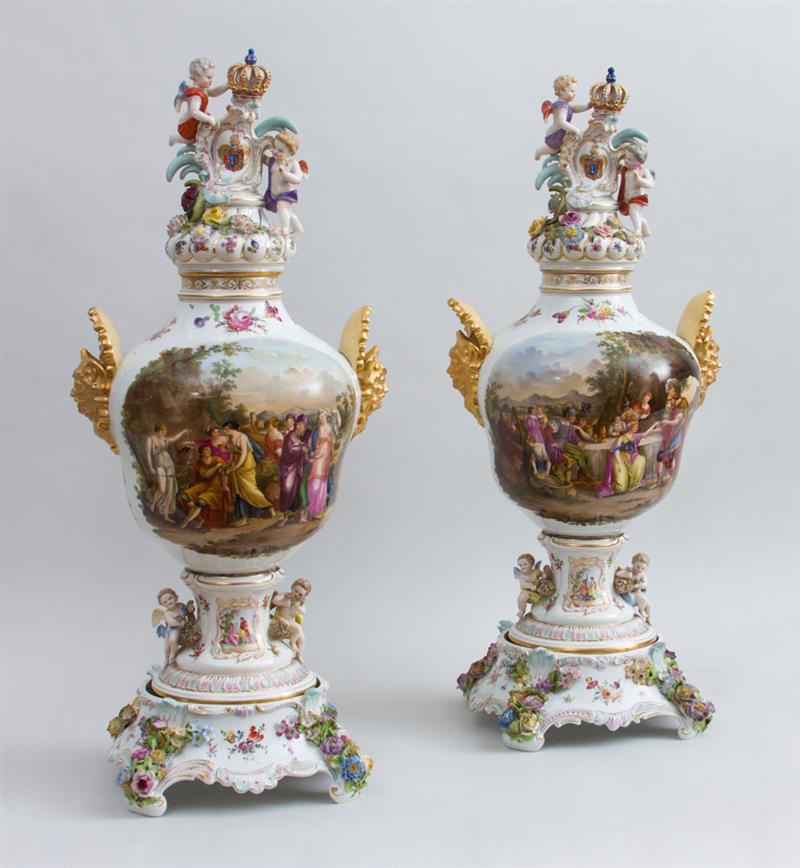 Appraisal: PAIR OF GERMAN ROCOCO STYLE PORCELAIN LARGE PICTORIAL VASES COVERS