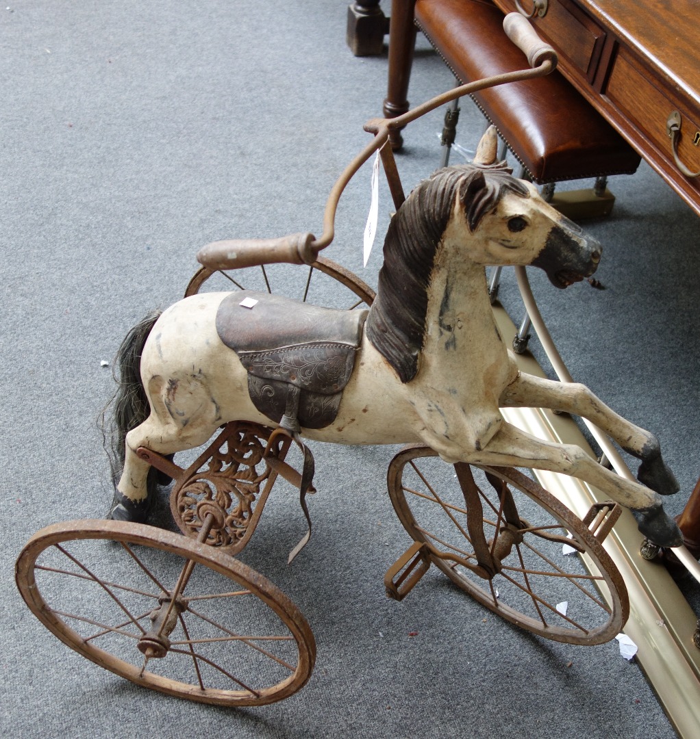 Appraisal: A reproduction velocipede or child's horse tricycle late th century