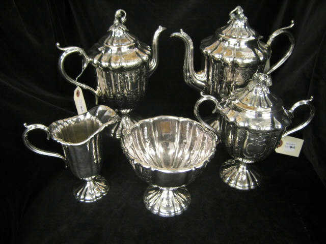 Appraisal: Victorian Silverplate Tea Coffee Service ribbed engraved floral berry finials