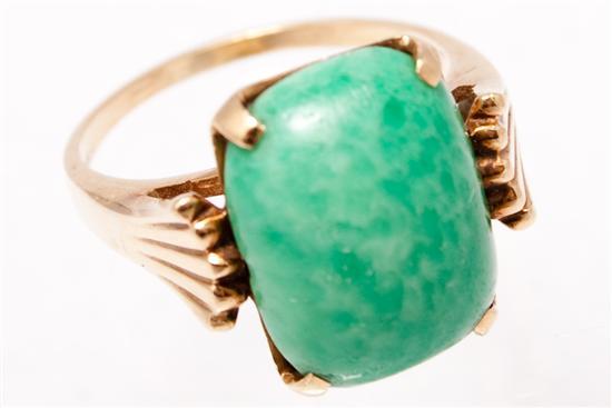 Appraisal: Lady's K yellow gold and polished green stone ring size