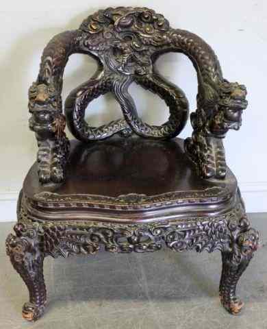 Appraisal: Heavily Carved Asian Chair with Dragon Armsand Intertwined Back From