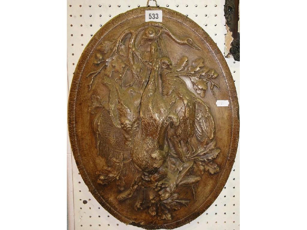 Appraisal: An oval plaster relief plaque of game including a hare