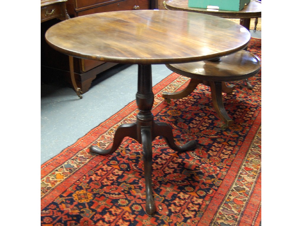 Appraisal: A George III mahogany tripod table the circular tilt top