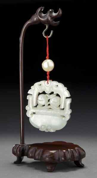 Appraisal: Chinese Qing carved white jade pendantdepicting a swinging flower basket