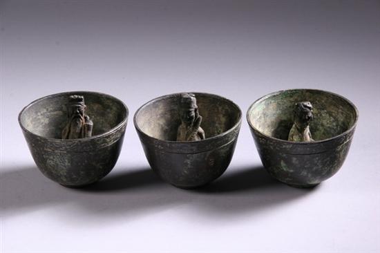 Appraisal: EIGHT CHINESE BRONZE FIGURAL BOWLS Each with different interior figure