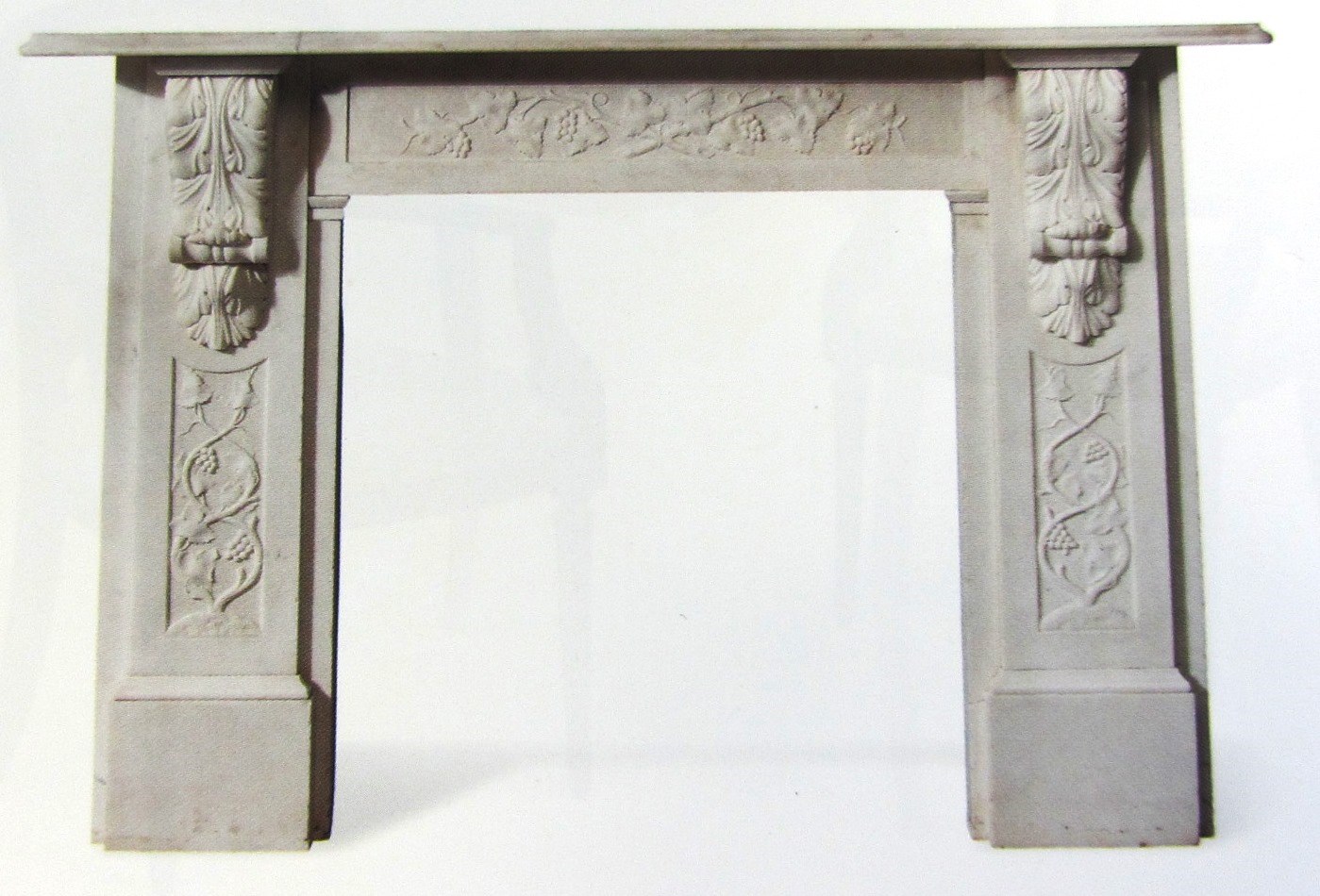 Appraisal: A th century white marble fire surround with carved vine