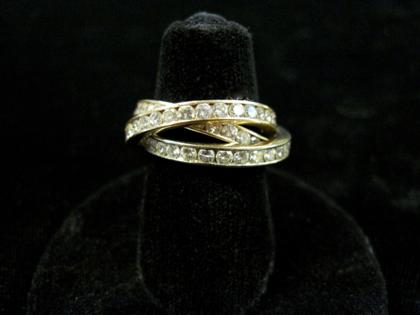 Appraisal: karat tri-color gold and diamond 'puzzle' ringEach band fully channel