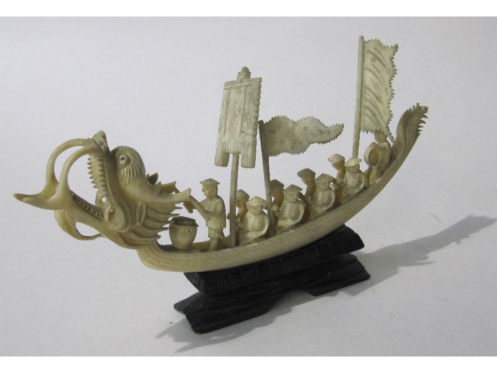 Appraisal: Lot comprising carved ivory model dragon boat and pennants