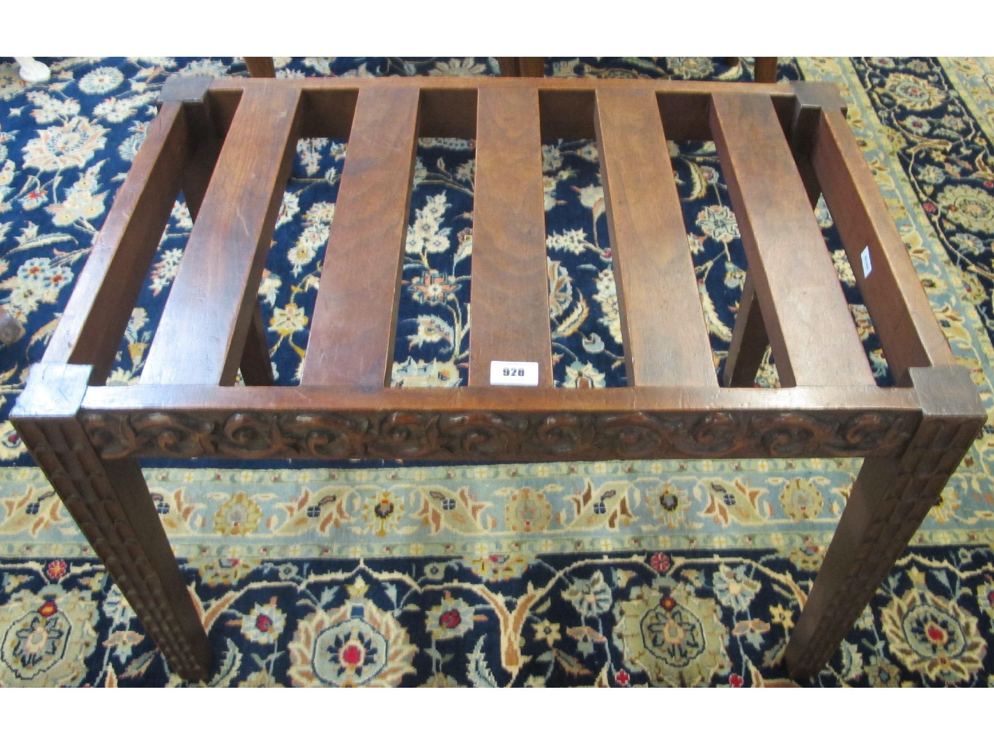 Appraisal: A mahogany carved luggage rack