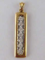 Appraisal: A yellow metal tests carat gold diamond pendant approx cm