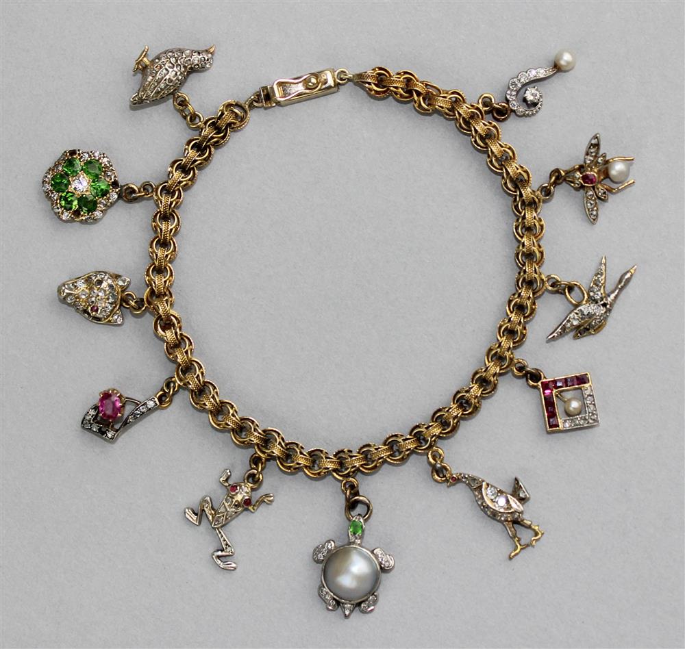 Appraisal: K YELLOW GOLD CHARM BRACELET WITH ELEVEN CHARMS the charm