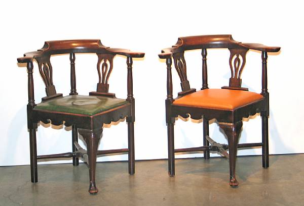 Appraisal: A pair of George II style mahogany corner chairs late