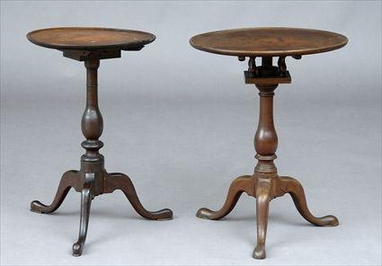 Appraisal: TWO CHIPPENDALE MAHOGANY TILT-TOP TRIPOD CANDLE STANDS The larger with