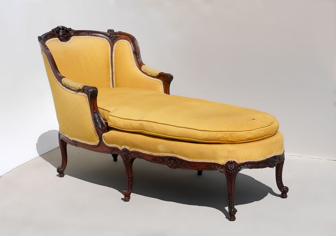 Appraisal: VICTORIAN CARVED CHAISE LOUNGE Carved wood frame shaped top rail