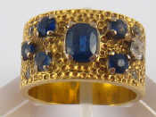 Appraisal: A yellow metal tests carat gold sapphire and diamond ring