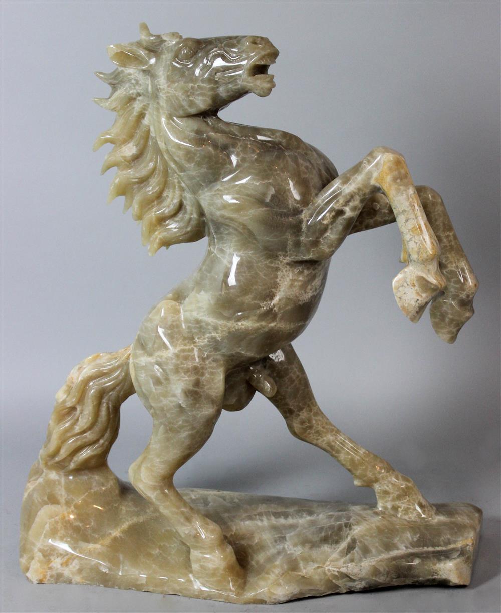 Appraisal: CHINESE MODEL OF A POLISHED STONE REARING HORSE the horse