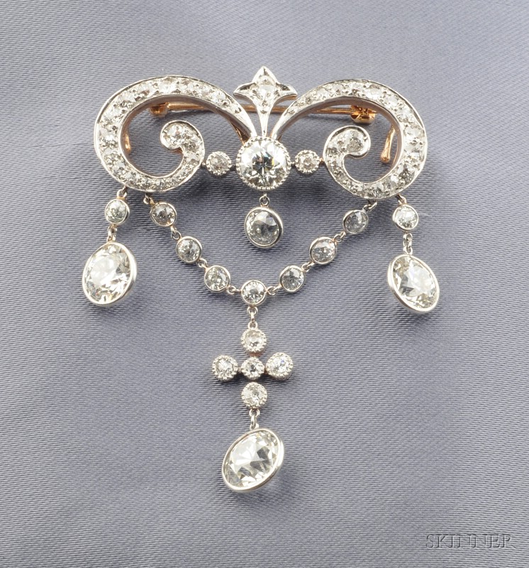 Appraisal: Edwardian Diamond Pendant Brooch the scrolling form with flexible swags