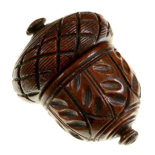 Appraisal: Treen A richly patinated turned and carved wood nutmeg or