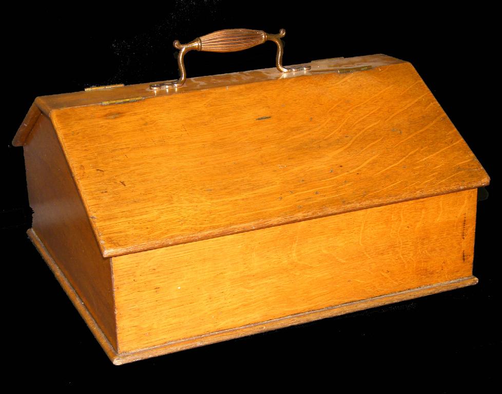 Appraisal: Victorian oak knife box with a brass carrying handle over