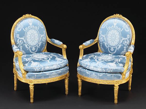 Appraisal: A pair of Louis XVI style giltwood fauteuils la reine