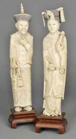 Appraisal: Pair Of Chinese Carved Ivory FiguresBoth finely carved to depict