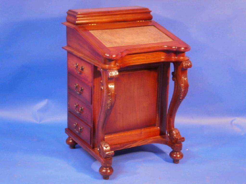 Appraisal: A Victorian style mahogany Davenport desk with leather inset trinket