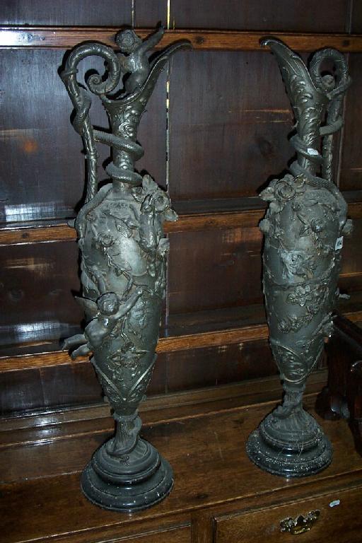 Appraisal: A pair of large th century Spelter ornamental ewers with