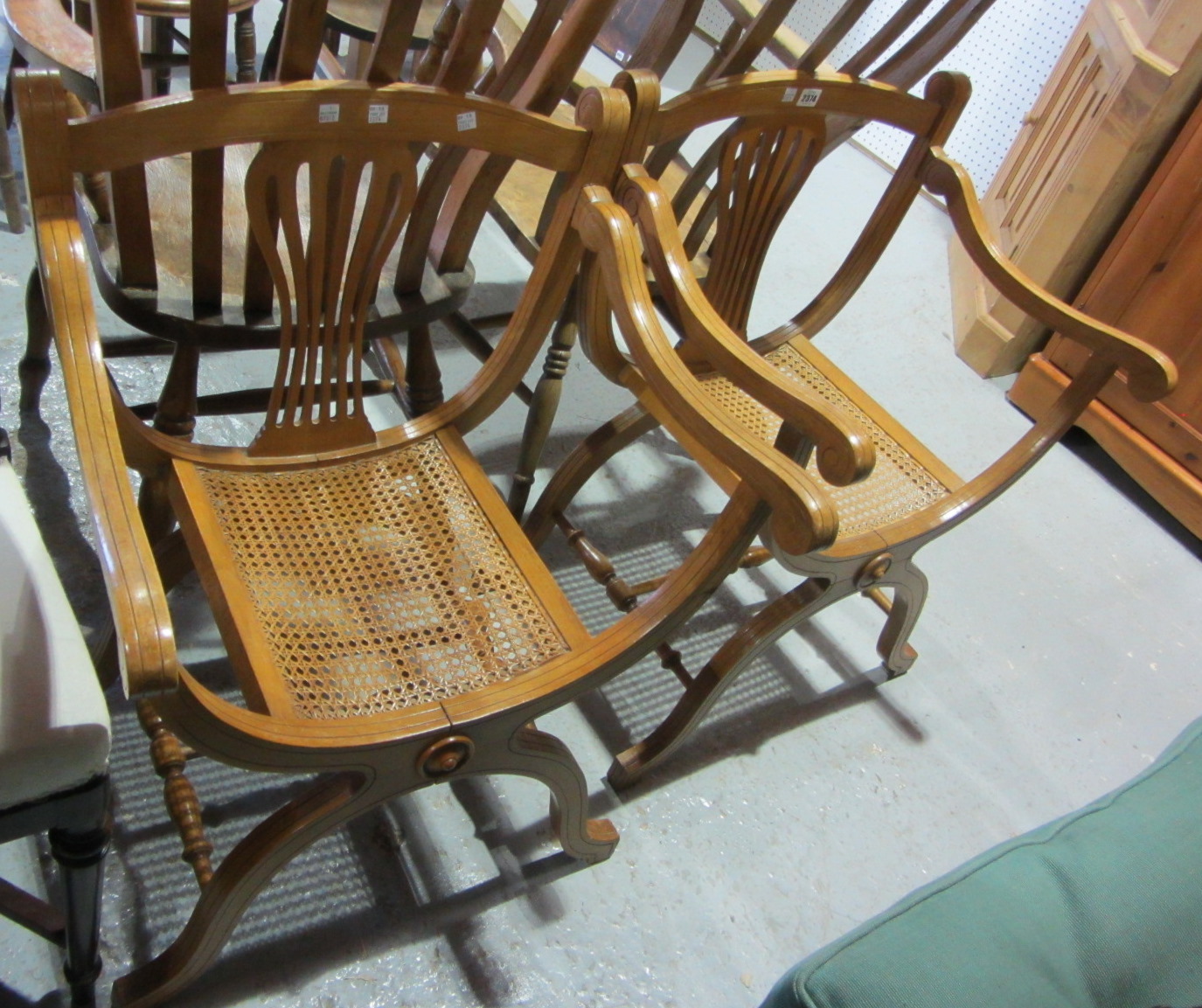 Appraisal: A pair of th century beech 'X' frame chairs with