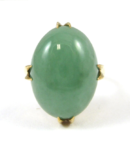 Appraisal: JADE AND EIGHTEEN KARAT GOLD RING set with a single