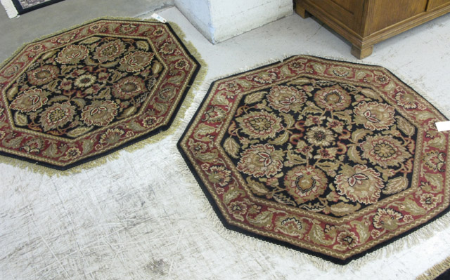 Appraisal: A PAIR OF OCTAGONAL ORIENTAL AREA RUGS Indo-Persian matching floral