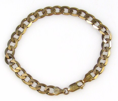 Appraisal: A modern open link bracelet with plain clasp yellow metal