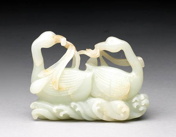 Appraisal: A pale greenish-white jade carving of two geese Each posed